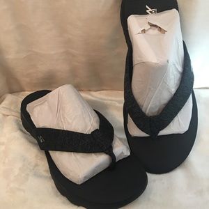Sketchers flip flops in size 9.